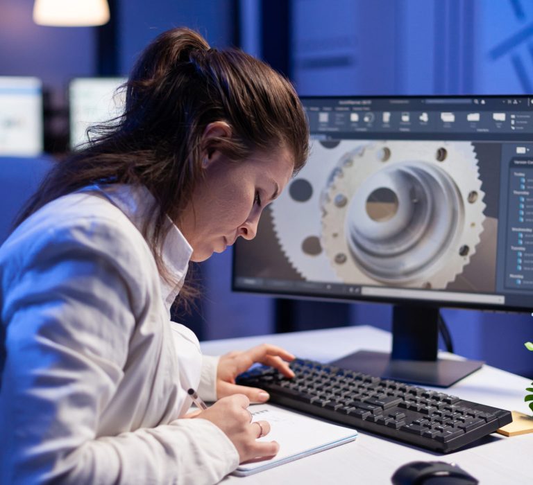 Woman engineer architect working in modern cad program sitting at desk in start-up business office. Industrial employee start new prototype idea on computer using inovative design concept